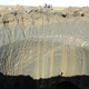 A photo taken on August 25, 2014 shows a crater on the Yamal Peninsula, northern Siberia.